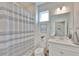 Clean and bright bathroom with a shower, toilet, vanity and modern fixtures at 314 Blackrock Ln, Apollo Beach, FL 33572