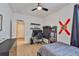 Stylish bedroom with a ceiling fan, a desk area, and sleek, modern furniture at 314 Blackrock Ln, Apollo Beach, FL 33572