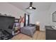 Stylish bedroom with a ceiling fan, a desk area, and sleek, modern furniture at 314 Blackrock Ln, Apollo Beach, FL 33572