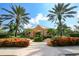 Attractive community building framed by lush landscaping and towering palm trees, enhancing the neighborhood's charm at 314 Blackrock Ln, Apollo Beach, FL 33572