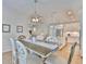 Inviting dining room with wood table, decorative chairs, and direct kitchen access at 314 Blackrock Ln, Apollo Beach, FL 33572