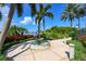 Scenic view of a tiered fountain surrounded by lush landscaping and palm trees at 314 Blackrock Ln, Apollo Beach, FL 33572