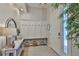Well-decorated foyer featuring a bench with hooks, a console table, and natural light at 314 Blackrock Ln, Apollo Beach, FL 33572