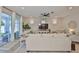 Bright living room with backyard access, featuring neutral colors and an open floor plan perfect for entertaining at 314 Blackrock Ln, Apollo Beach, FL 33572