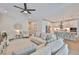 Bright, open-concept living room and kitchen with stainless steel appliances and modern finishes create a great space at 314 Blackrock Ln, Apollo Beach, FL 33572