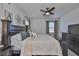 Bright main bedroom features great natural light, a dark wood dresser, and a neutral color scheme at 314 Blackrock Ln, Apollo Beach, FL 33572