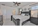 Spacious main bedroom with a king bed, dark furniture, and access to an ensuite bathroom at 314 Blackrock Ln, Apollo Beach, FL 33572