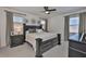 Spacious main bedroom features a dark wood bed frame, neutral color scheme, and great natural light at 314 Blackrock Ln, Apollo Beach, FL 33572