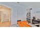 Comfortable home office with built-in shelving, desk, and view of the staircase at 314 Blackrock Ln, Apollo Beach, FL 33572