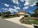 Charming two-story home featuring a paved driveway and well-maintained landscaping at 413 Midway Is, Clearwater Beach, FL 33767