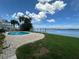 View of the outdoor pool with a waterfront view of the Intracoastal waterway at 413 Midway Is, Clearwater Beach, FL 33767