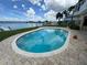 Beautiful waterfront pool with brick patio and access to the bay at 413 Midway Is, Clearwater Beach, FL 33767