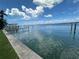 Calm waterfront view showing the intracoastal waterway with blue skies and fluffy white clouds at 413 Midway Is, Clearwater Beach, FL 33767