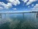 Calm waterfront view showing the intracoastal waterway with blue skies and fluffy white clouds at 413 Midway Is, Clearwater Beach, FL 33767