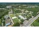 An aerial view of the community featuring houses, trees, streets, and green spaces at 4222 Glade Wood Loop, New Port Richey, FL 34655