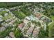 A beautiful aerial view of a residential community, highlighting the pool, landscaping, and well-maintained properties at 4222 Glade Wood Loop, New Port Richey, FL 34655