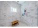 Shower with tiled walls and updated fixtures at 4222 Glade Wood Loop, New Port Richey, FL 34655