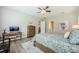 Bright bedroom boasting wood floors and a walk-in closet at 4222 Glade Wood Loop, New Port Richey, FL 34655