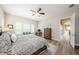 Bedroom features wood flooring, plantation shutters and is freshly painted at 4222 Glade Wood Loop, New Port Richey, FL 34655