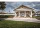 Exterior view of Longleaf community common with covered seating and double door entry at 4222 Glade Wood Loop, New Port Richey, FL 34655