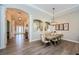 Formal dining room featuring wood-look tile flooring and arched openings at 4222 Glade Wood Loop, New Port Richey, FL 34655