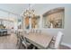 A view of the dining area featuring decorative alcoves with modern decor and a chandelier at 4222 Glade Wood Loop, New Port Richey, FL 34655