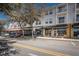 A multi-story commercial building with ground-level retail spaces and street parking in a city setting at 4222 Glade Wood Loop, New Port Richey, FL 34655