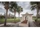 Community gazebo with flower bed and a pathway, providing a relaxing outdoor gathering space for residents at 4222 Glade Wood Loop, New Port Richey, FL 34655