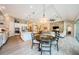 Open kitchen and dining area with modern appliances, connecting seamlessly to the living room at 4222 Glade Wood Loop, New Port Richey, FL 34655