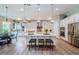 The spacious kitchen has a large center island, stainless appliances, and pendant lighting at 4222 Glade Wood Loop, New Port Richey, FL 34655
