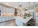 Bright, spacious kitchen with a large island, stainless steel appliances and stylish pendant lighting at 4222 Glade Wood Loop, New Port Richey, FL 34655
