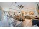 Open-concept living space boasts a dining room and flows into a modern kitchen area at 4222 Glade Wood Loop, New Port Richey, FL 34655