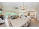 Open-concept living area shows a kitchen, dining area and living room with lots of natural light at 4222 Glade Wood Loop, New Port Richey, FL 34655