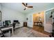 Bright office space with ceiling fan, stylish decor, and glass paneled french doors at 4222 Glade Wood Loop, New Port Richey, FL 34655