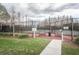 The community tennis courts with a black fence are available for residents at 4222 Glade Wood Loop, New Port Richey, FL 34655