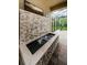 Elegant stone water feature enhancing the outdoor living space at 4222 Glade Wood Loop, New Port Richey, FL 34655