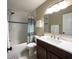 Clean bathroom with a shower-tub combo, stylish vanity, and a well-lit mirror at 4404 Hickory Branch Ct, Brandon, FL 33511