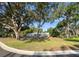 Spacious front yard with home, stone details, and mature trees at 4404 Hickory Branch Ct, Brandon, FL 33511