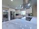 Modern kitchen with white cabinets, stainless steel appliances, a marble countertop, and a sleek cooktop at 4404 Hickory Branch Ct, Brandon, FL 33511