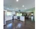 Spacious open-concept kitchen featuring sleek countertops, modern appliances, and easy access to the living area at 4404 Hickory Branch Ct, Brandon, FL 33511