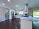 Contemporary kitchen featuring white cabinetry, stainless appliances, and a view of the outdoors at 4404 Hickory Branch Ct, Brandon, FL 33511