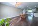 Open living area showcasing hardwood floors, natural light, and a dining space near the kitchen at 4404 Hickory Branch Ct, Brandon, FL 33511
