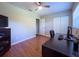 Functional home office setup with wood flooring, a desk, and ample space for productivity at 4404 Hickory Branch Ct, Brandon, FL 33511