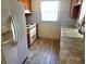 Cozy kitchen features a white refrigerator, light countertops and wood cabinets at 4407 Westwood Dr, Holiday, FL 34691