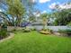 Spacious, well-manicured lawn with mature landscaping, offering a serene and private outdoor space at 4610 Westford Cir, Tampa, FL 33618