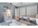 Shared bedroom features twin beds, tile floors, two closets and blue walls at 4610 Westford Cir, Tampa, FL 33618