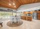 Bright kitchen featuring wood-paneled ceiling, stainless steel appliances, and adjacent dining area at 4610 Westford Cir, Tampa, FL 33618