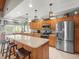 Well-equipped kitchen with custom cabinets, stainless steel appliances and eat-in island at 4610 Westford Cir, Tampa, FL 33618