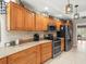 Bright kitchen features stainless steel appliances, tile backsplash, and granite counters at 4610 Westford Cir, Tampa, FL 33618