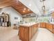 Large kitchen with wood-paneled ceiling, granite countertops and lots of natural light at 4610 Westford Cir, Tampa, FL 33618